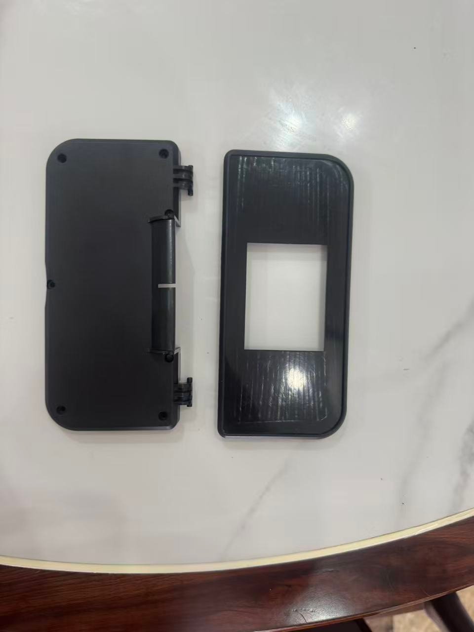 PC injection molded electronics enclosure with integrated hinge