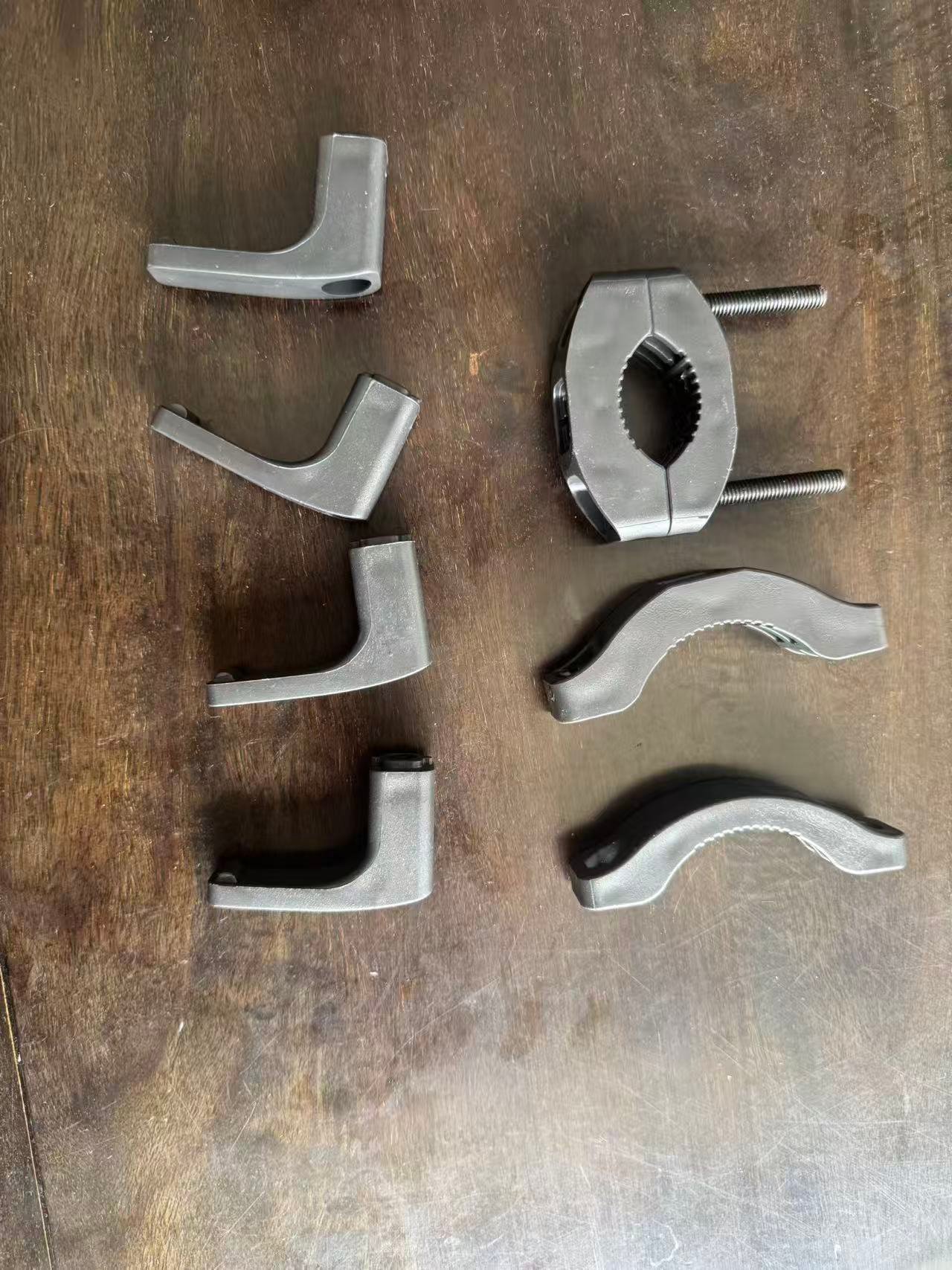 Injection molded components for an adjustable clamp assembly