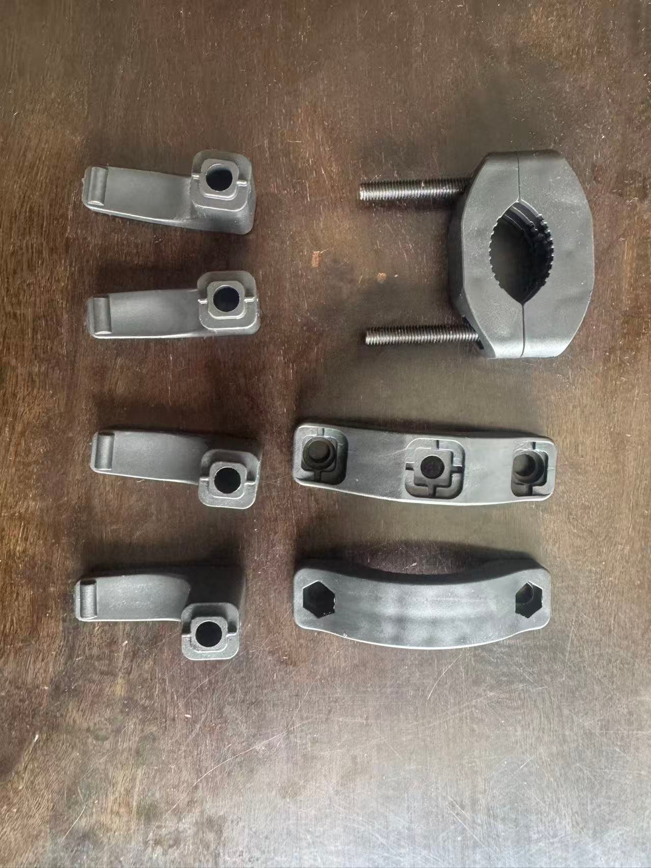 Reverse view of injection molded adjustable clamp assembly components